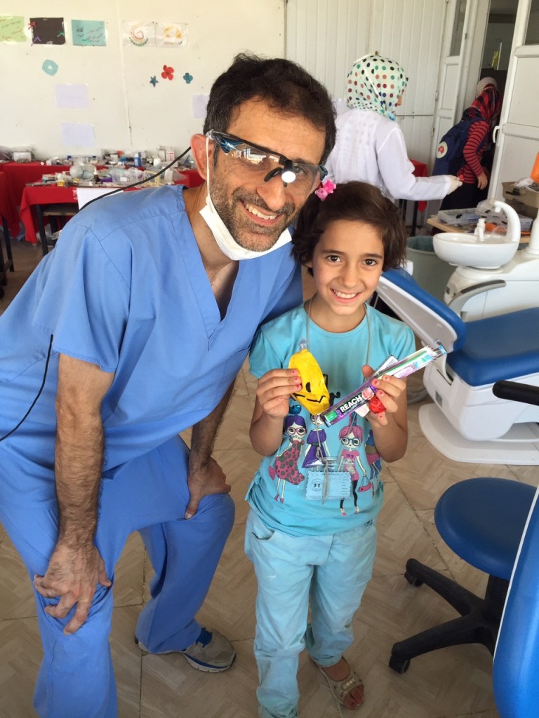 Dr. Shuaib Malik with a young girl 