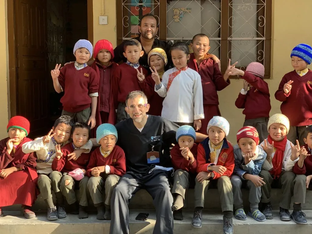 Dr. Sinha with young students