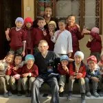 Dr. Sinha with young students