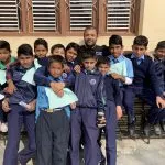 Dr. Sinha with young children in Nepal