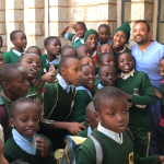 Dr. Sinha with young children in Kenya