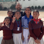 Dr. Sinha with young students