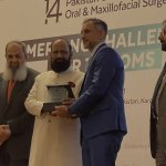 Dr. Malik getting an award